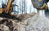 HCB Crushing bucket crushes demolition waste